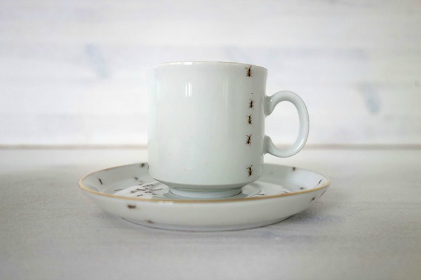 porcelain-dishes-covered-in-painted-ants