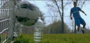 Klaas-Jan Huntelaar Kicks a ball toward a plastic bottle.