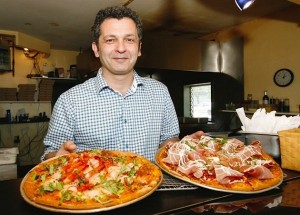 The $450 pizza (on the right) and the $120 pizza (on the left).