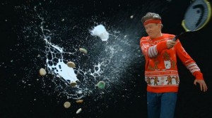 Conan destroys milk and cookies with a tennis racket.